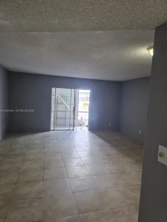 a kitchen with a sink and a refrigerator