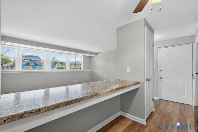 a view of kitchen island with wooden floor
