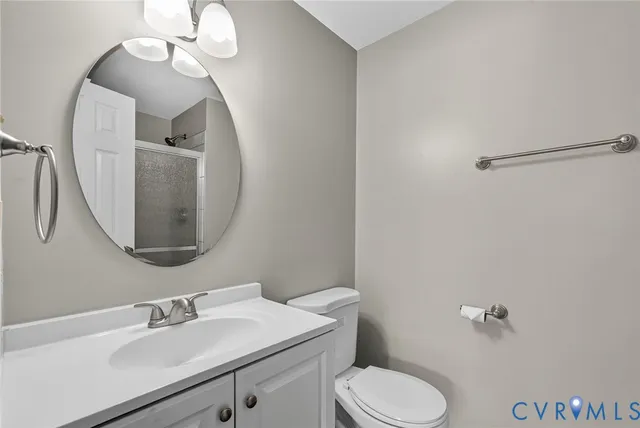 a bathroom with a shower and a glass door