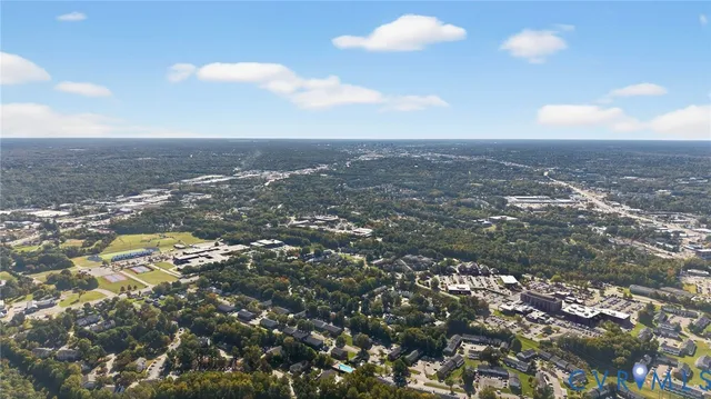 an aerial view of residential houses and outdoor space