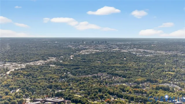 a aerial view of a house with a yard and garden
