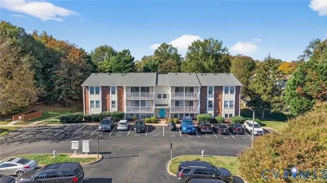 a view of a house with sitting area and garden