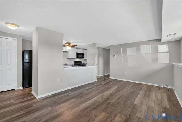 a view of kitchen with wooden floor