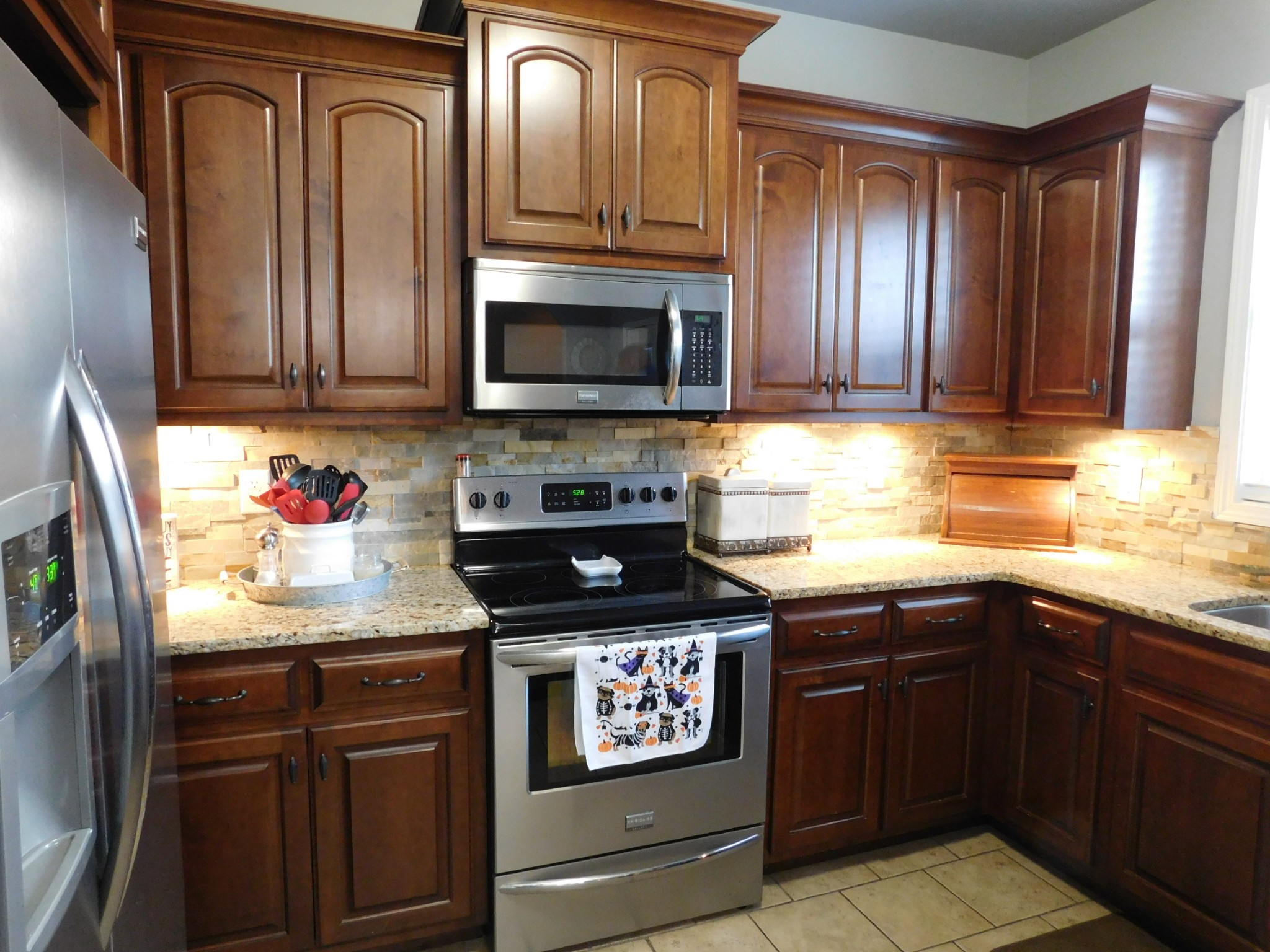 264 Fite Road Watertown, TN 37184 - Photo 22 of 43 a kitchen with granite countertop stainless steel appliances and wooden cabinets