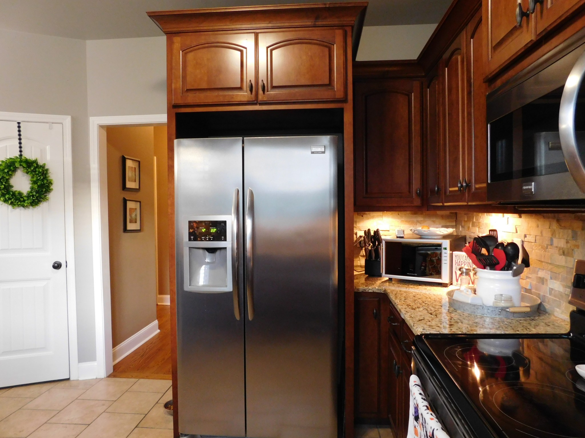 264 Fite Road Watertown, TN 37184 - Photo 23 of 43 a kitchen with a refrigerator and microwave