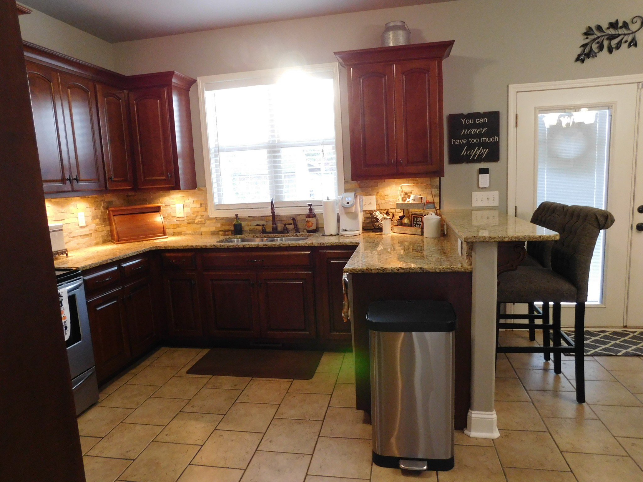 264 Fite Road Watertown, TN 37184 - Photo 24 of 43 a kitchen with a sink refrigerator and chairs
