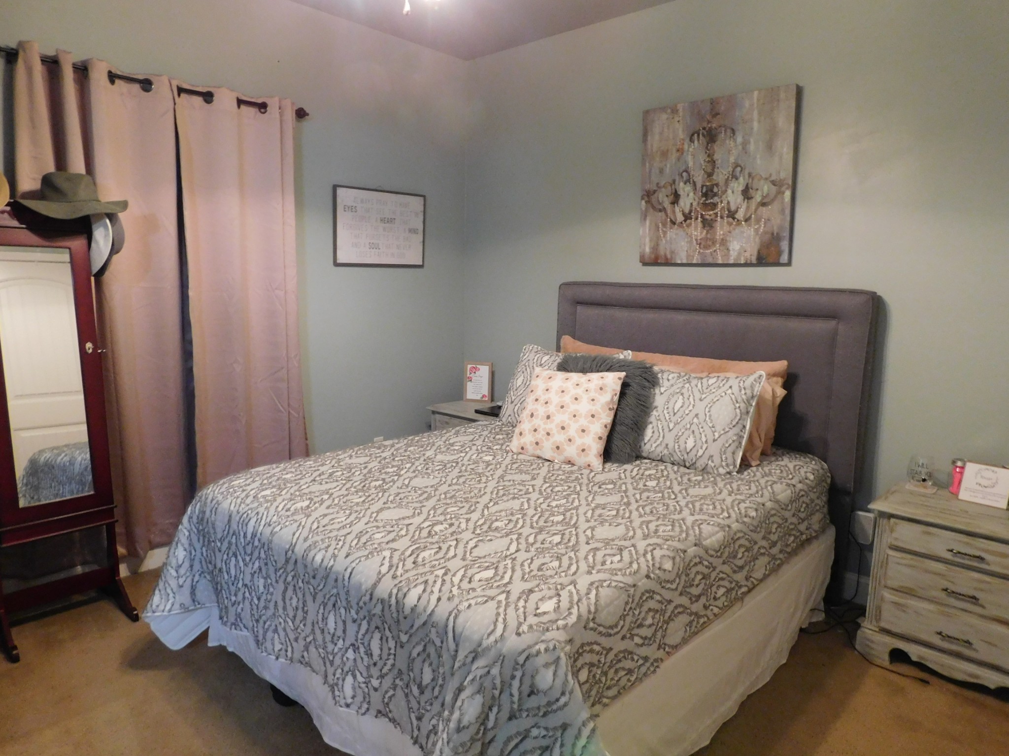 264 Fite Road Watertown, TN 37184 - Photo 32 of 43 a bedroom with bed and paintings on the wall