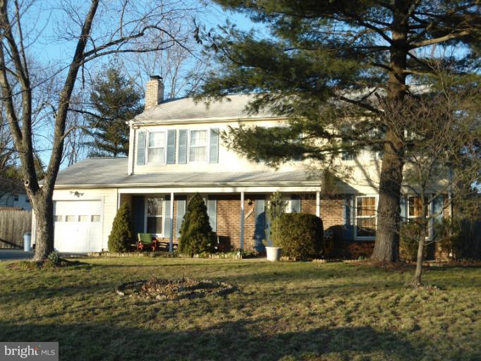 17321 Chiswell Road Poolesville, MD 20837 - Photo 4 of 5 a view of a house with yard and a tree