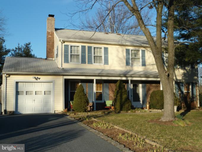 17321 Chiswell Road Poolesville, MD 20837 - Photo 5 of 5 a front view of a house with garden