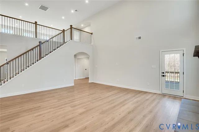 a view of a living room with furniture and a fireplace