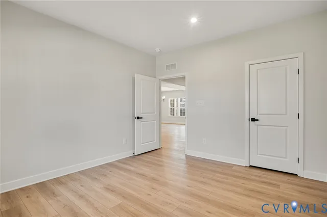 a bathroom with a toilet sink and a mirror