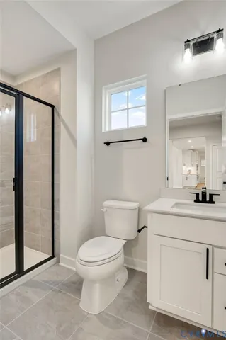 a bedroom with bed and a large window