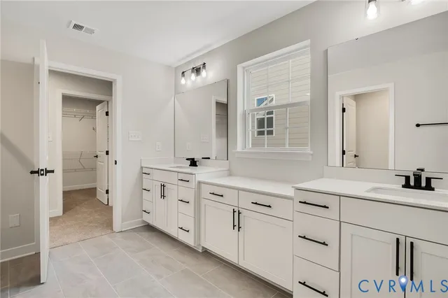 a bedroom with bed and a window