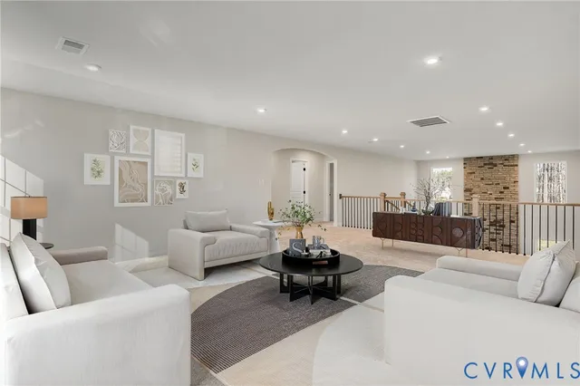 a living room with furniture and a table