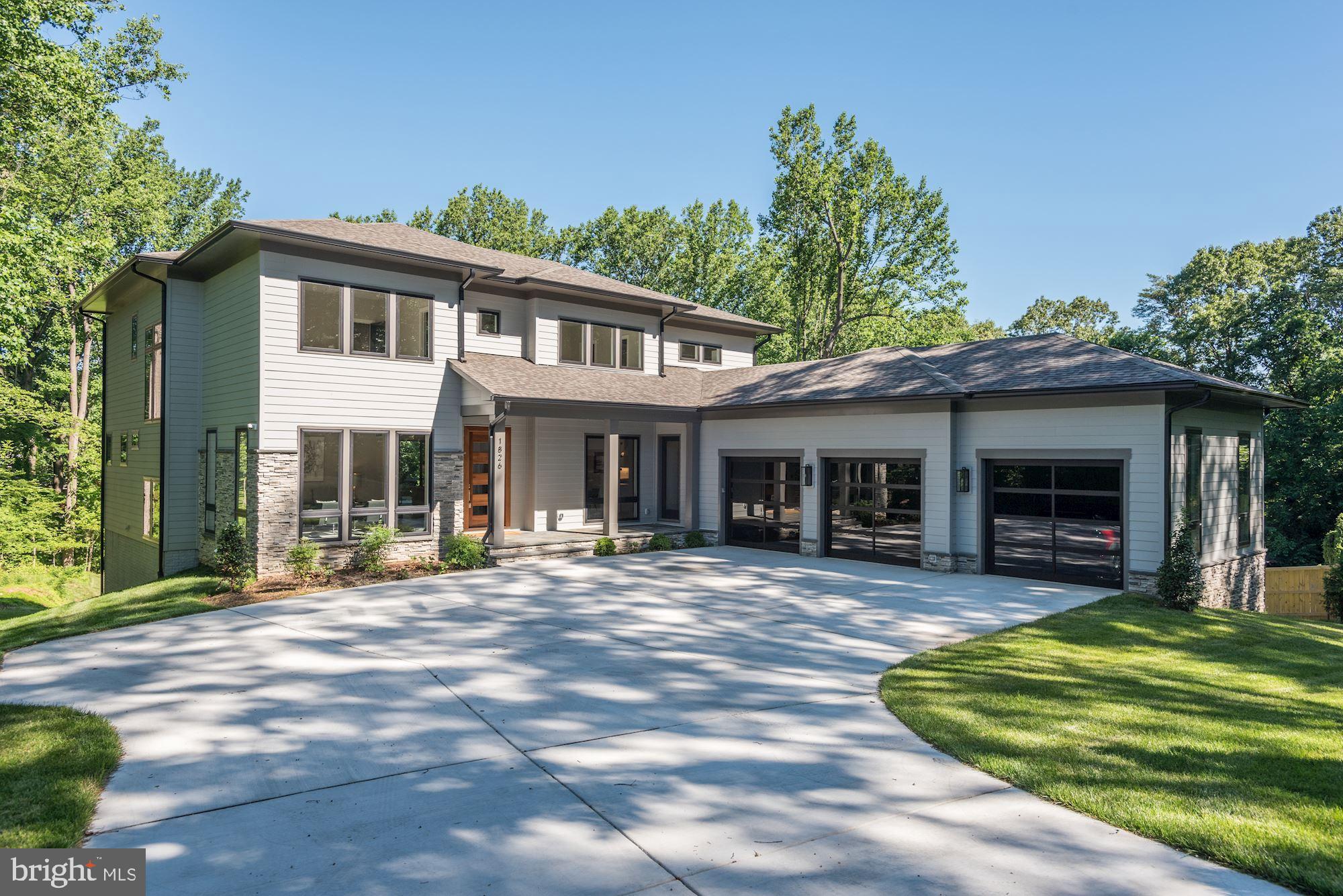 a front view of a house with a yard table and chairs