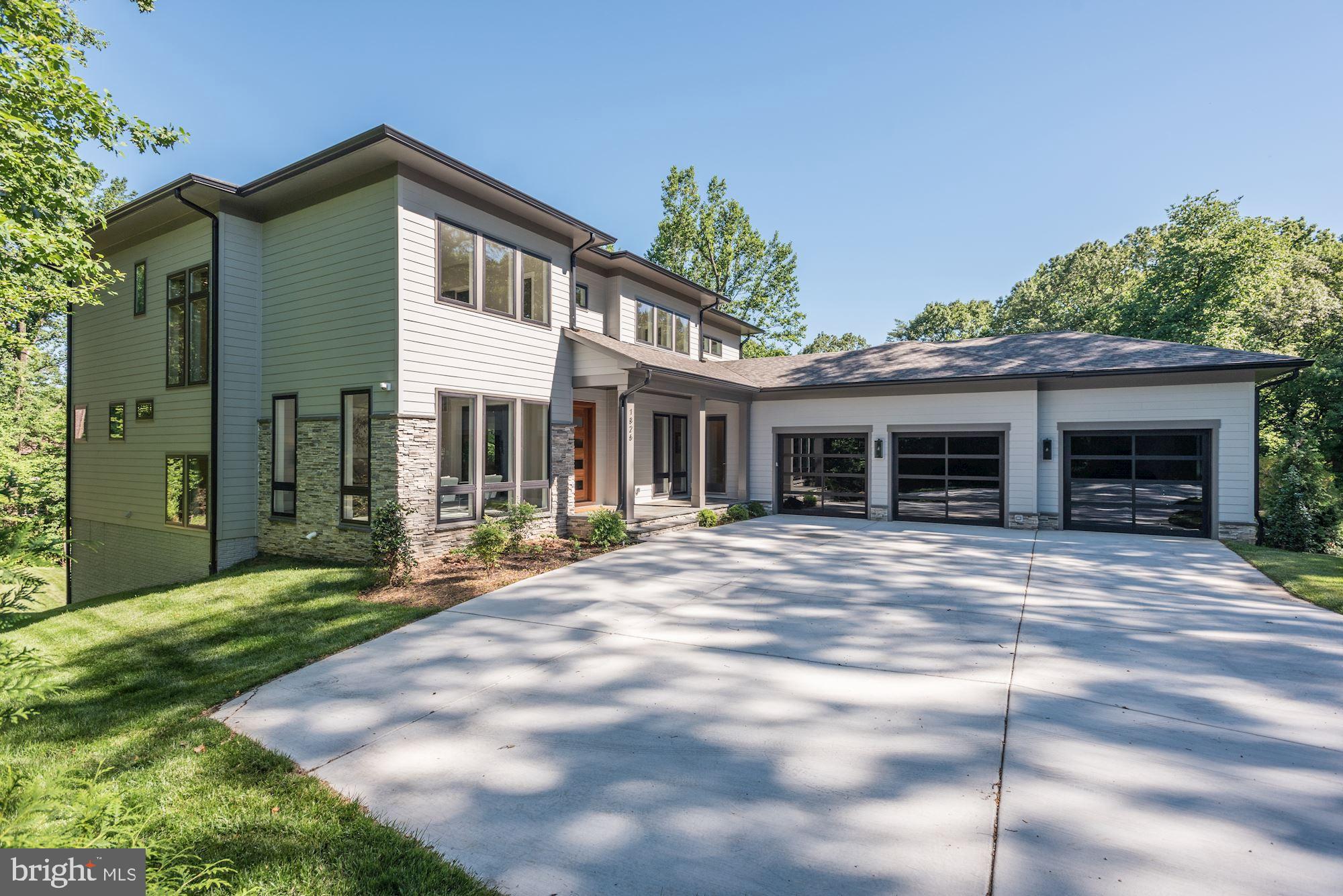 1826 Kirby Road McLean, VA 22101 - Photo 2 of 56 a front view of a house with yard and outdoor seating