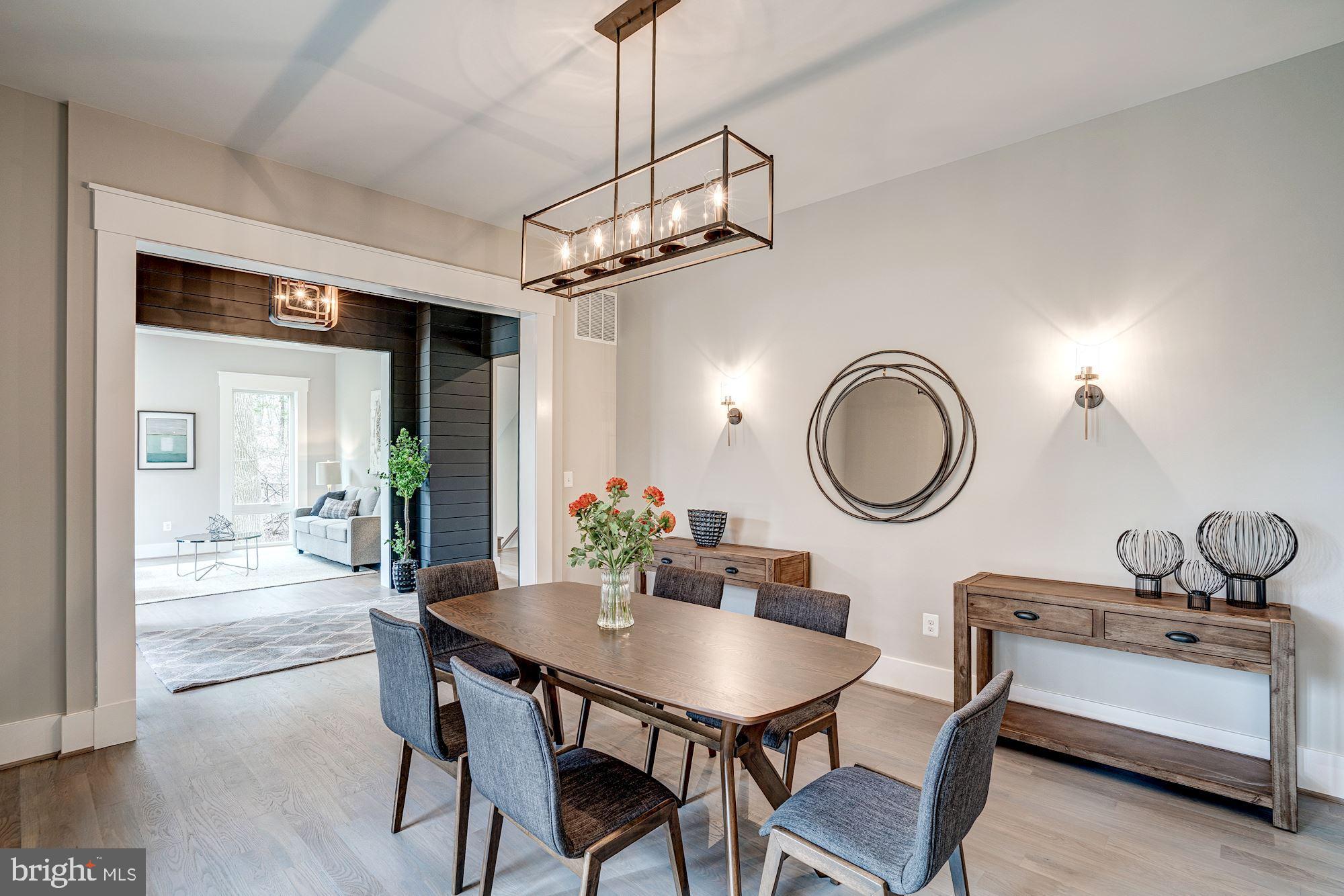 1826 Kirby Road McLean, VA 22101 - Photo 19 of 56 a view of a dining room and a kitchen with a table chairs