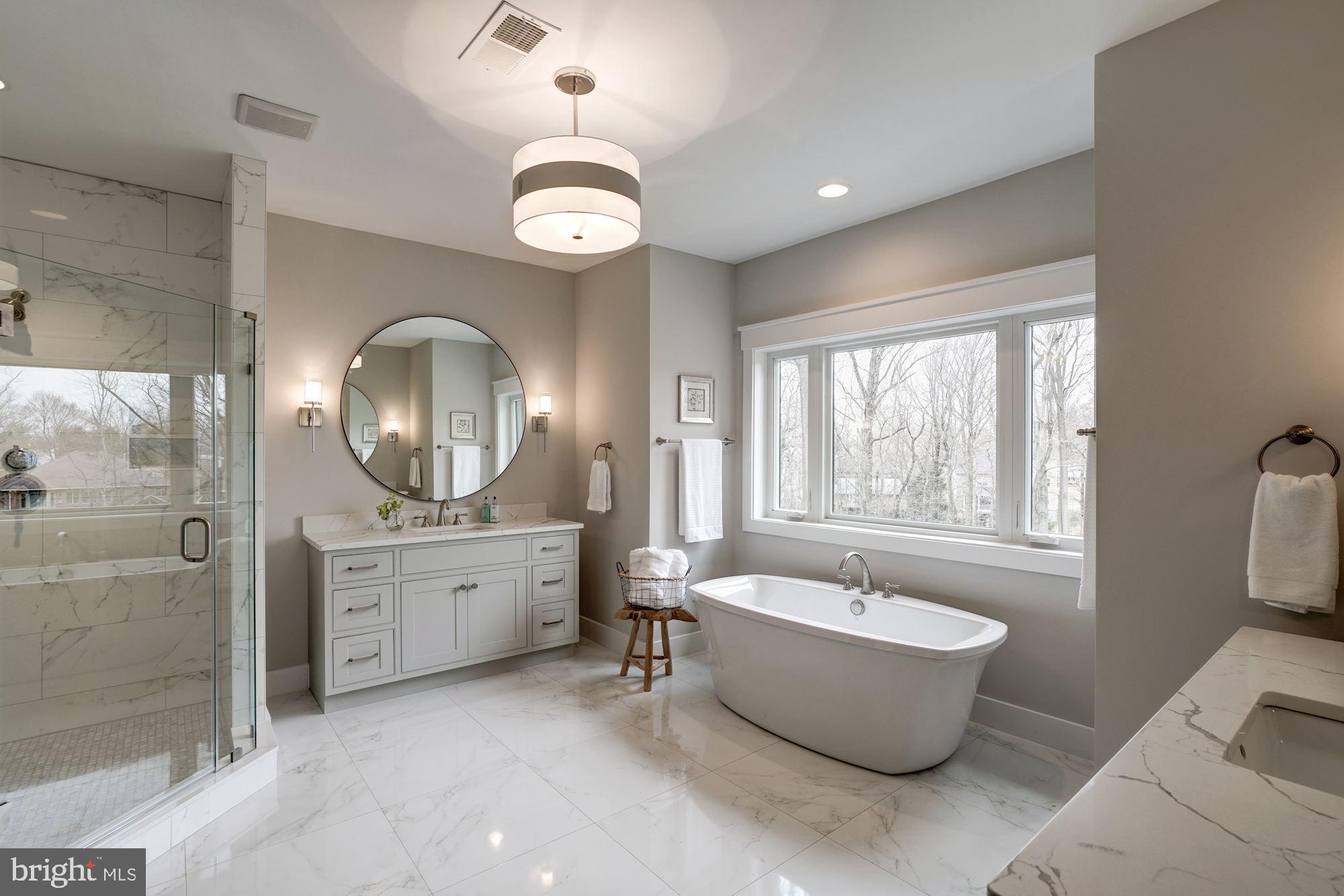 1826 Kirby Road McLean, VA 22101 - Photo 27 of 56 a large spacious bathroom with a large tub and chandelier