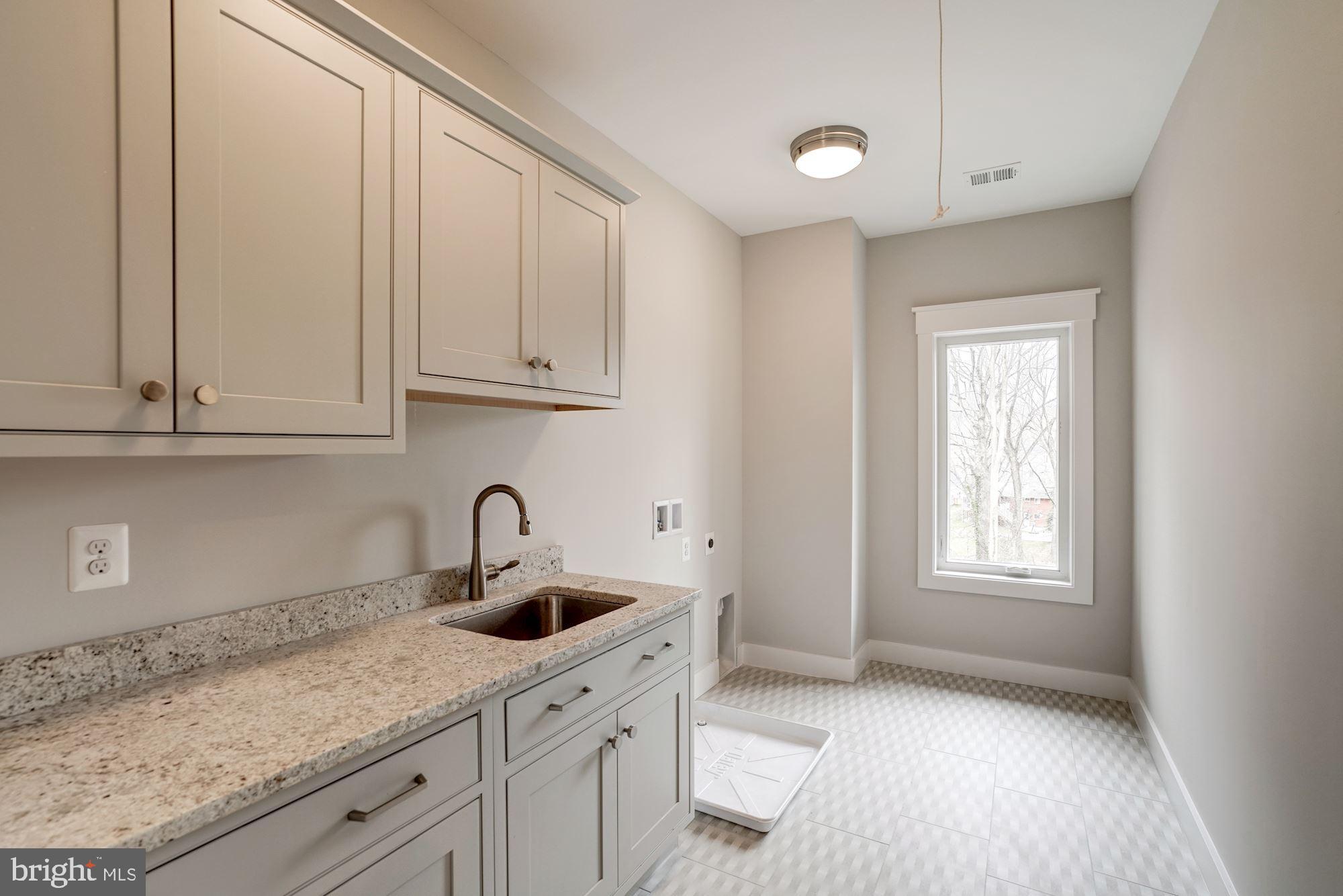 1826 Kirby Road McLean, VA 22101 - Photo 34 of 56 a kitchen with granite countertop white cabinets and sink