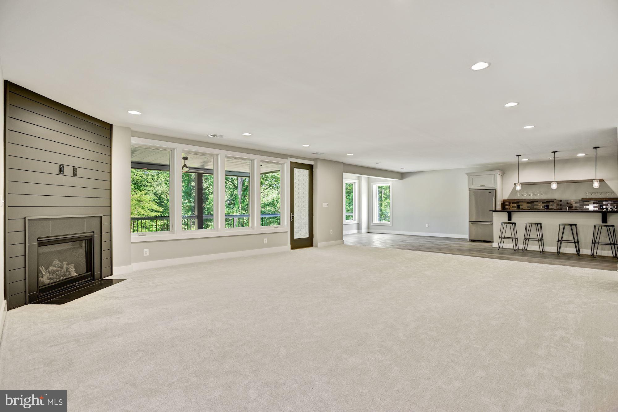 1826 Kirby Road McLean, VA 22101 - Photo 39 of 56 a view of an empty room with a fireplace and a window