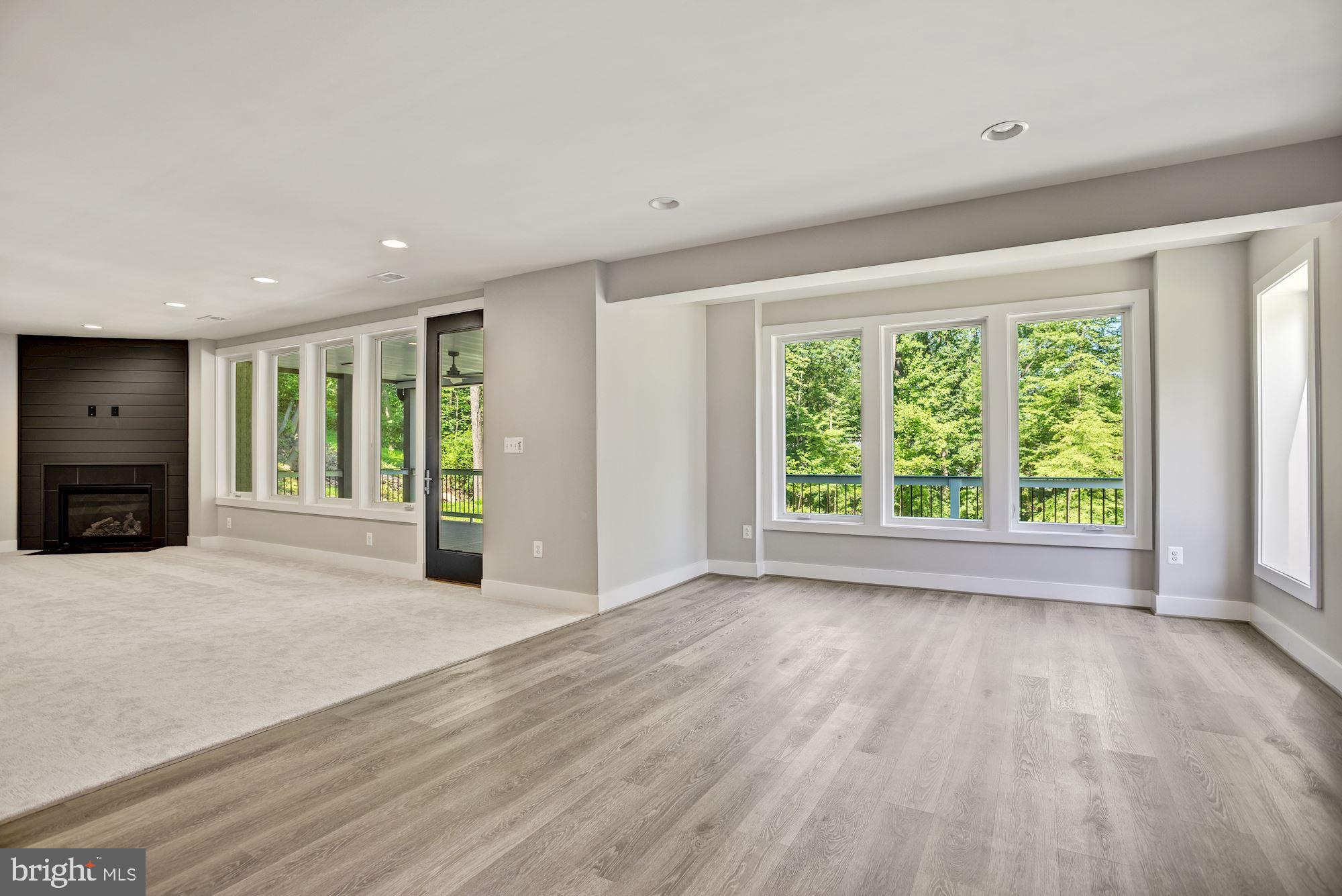 1826 Kirby Road McLean, VA 22101 - Photo 41 of 56 a view of an empty room with a window and wooden floor