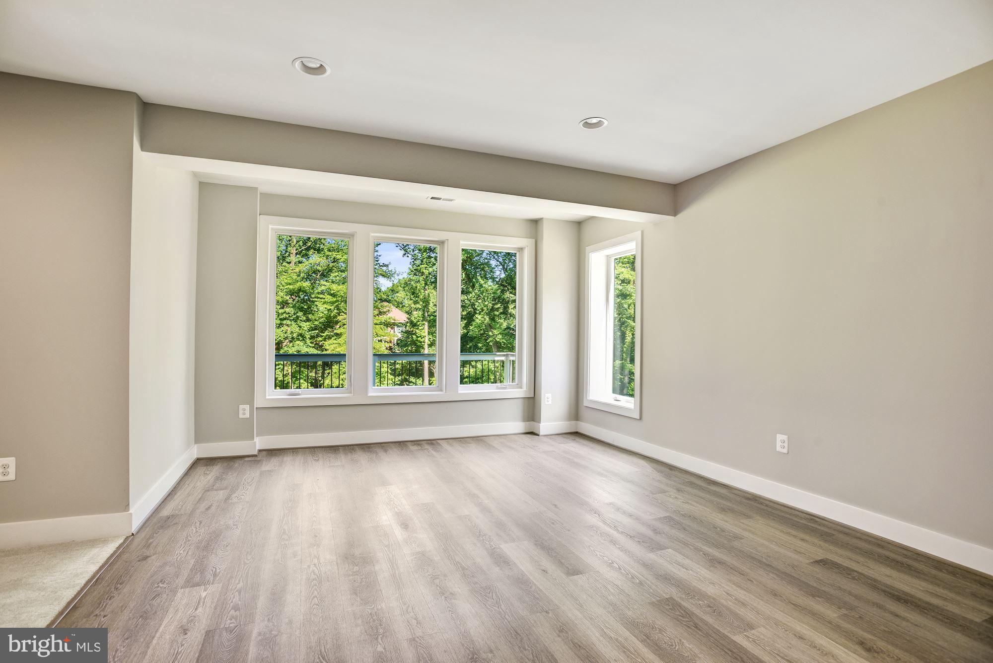 1826 Kirby Road McLean, VA 22101 - Photo 46 of 56 a view of an empty room with wooden floor and a window