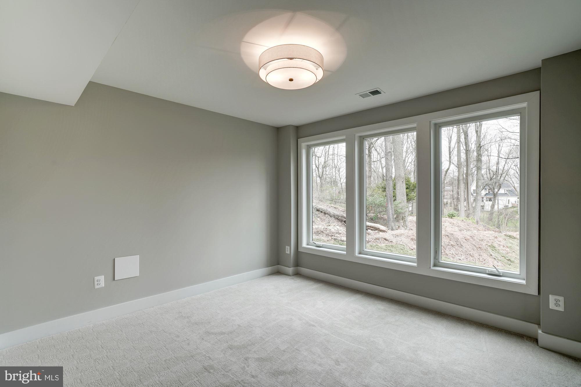1826 Kirby Road McLean, VA 22101 - Photo 47 of 56 a view of an empty room with a window