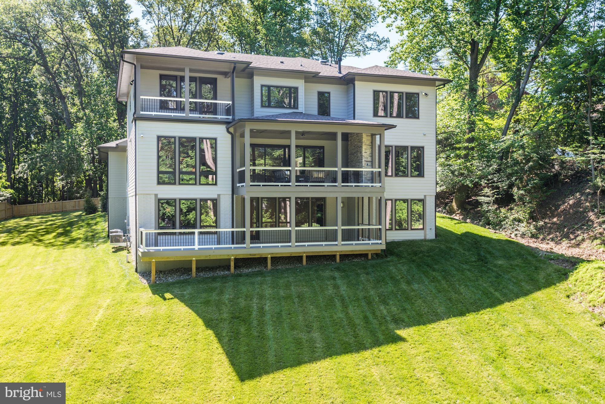 1826 Kirby Road McLean, VA 22101 - Photo 52 of 56 a front view of a house with a yard