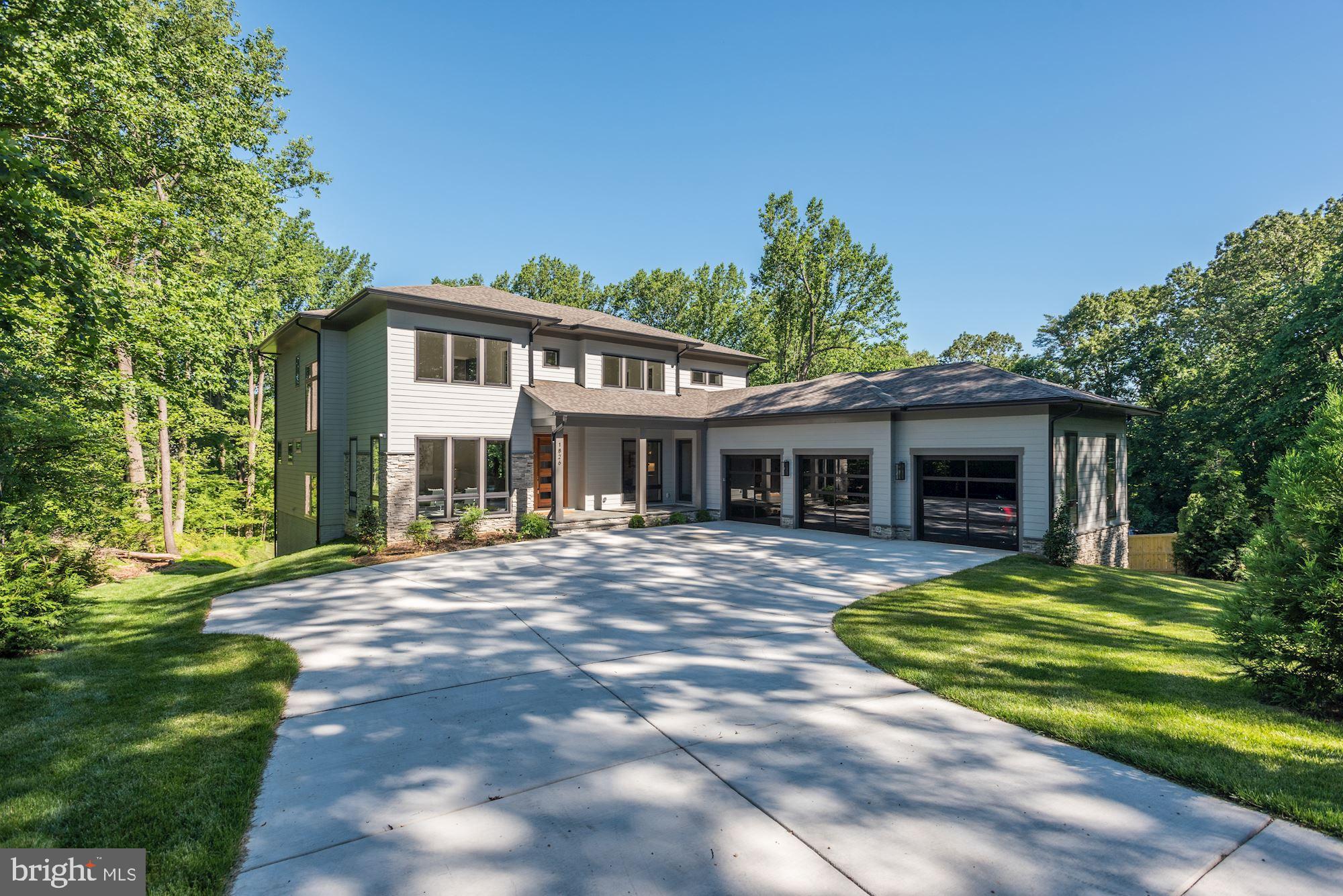1826 Kirby Road McLean, VA 22101 - Photo 54 of 56 a front view of a house with a garden