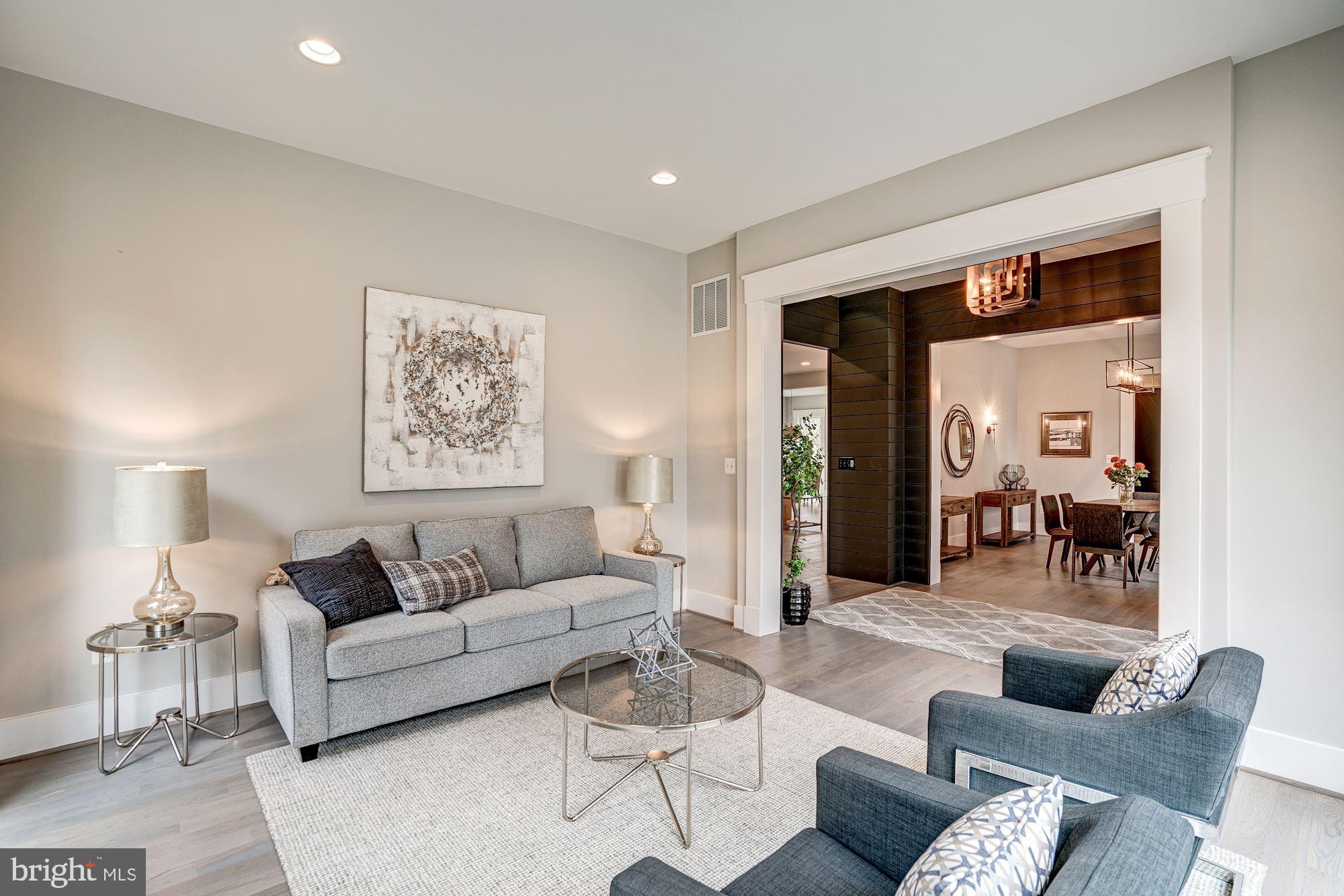 1826 Kirby Road McLean, VA 22101 - Photo 7 of 56 a living room with furniture and a painting on the wall