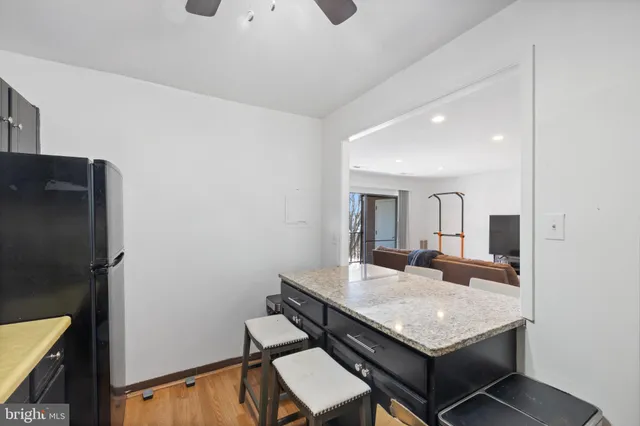 a dining room with a table and chairs