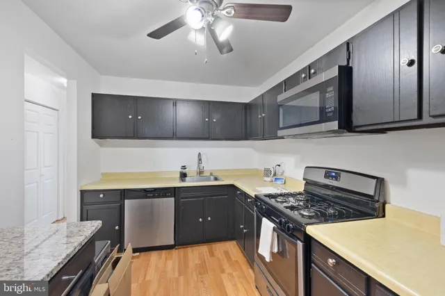 a kitchen with a stove and a sink