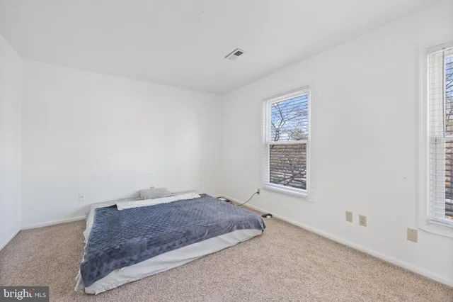 a room with a bed and a window