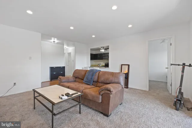 a living room with furniture a couch and a table