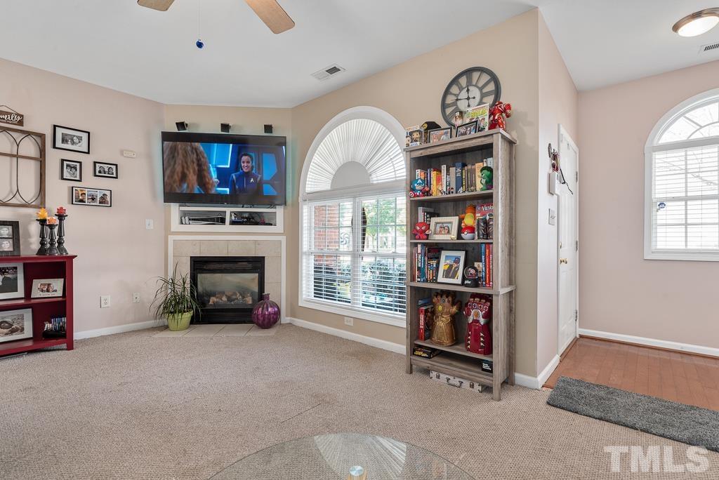 2041 Rivergate Road, Unit 104 Raleigh, NC 27614 - Photo 4 of 21 a living room with fireplace furniture and a window
