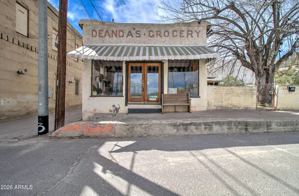 a front view of a building with retail shops