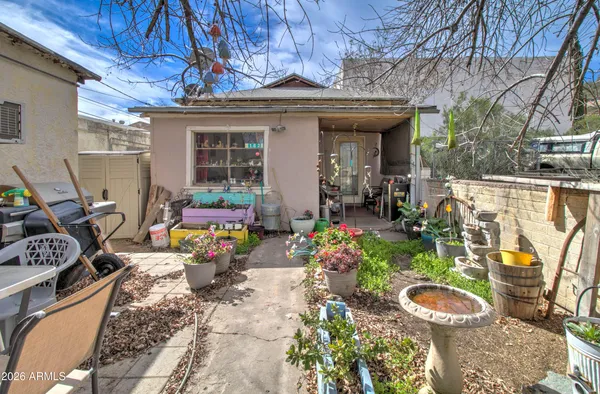 a view of a chairs and table in a patio