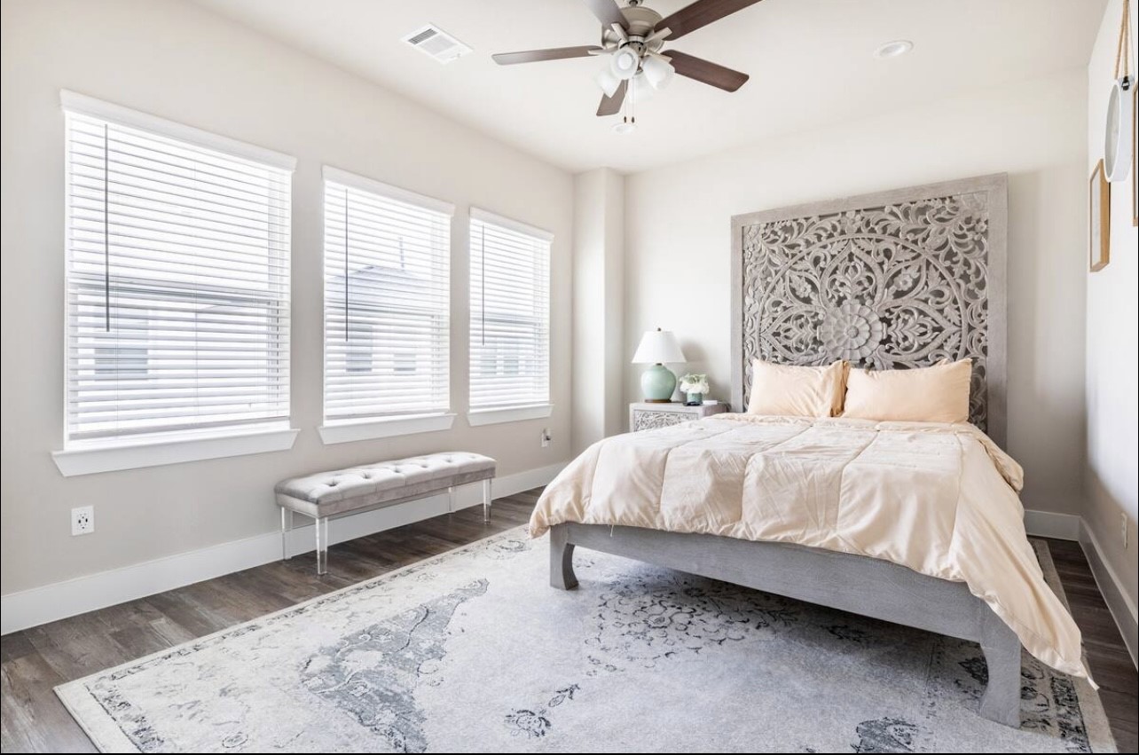 1740 Cove Crescent Houston, TX 77055 - Photo 15 of 44 a bedroom with a bed and window