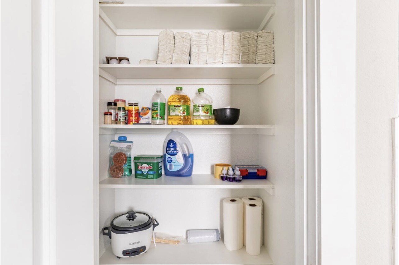 1740 Cove Crescent Houston, TX 77055 - Photo 22 of 44 a shelf with cup and plates