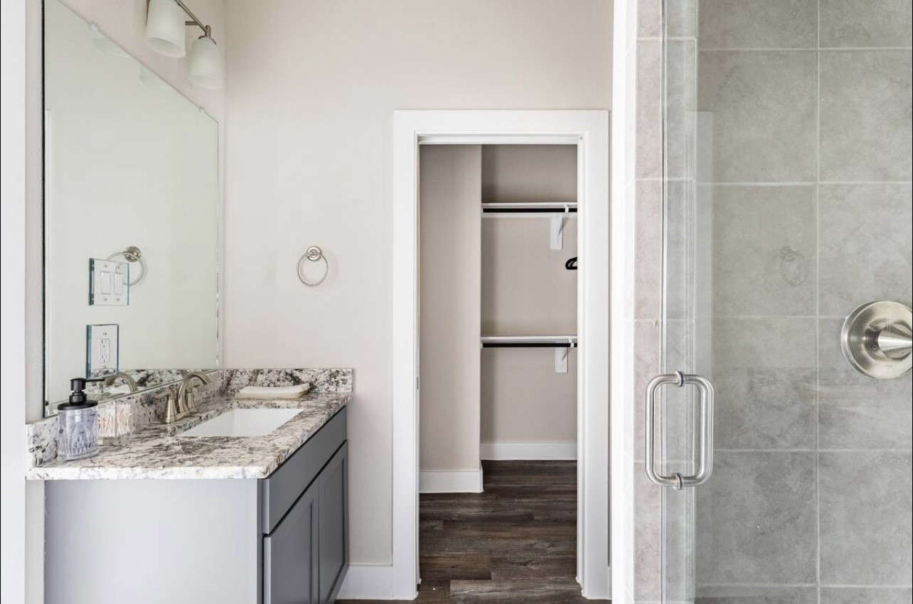 1740 Cove Crescent Houston, TX 77055 - Photo 32 of 44 a bathroom with a granite countertop sink and a mirror