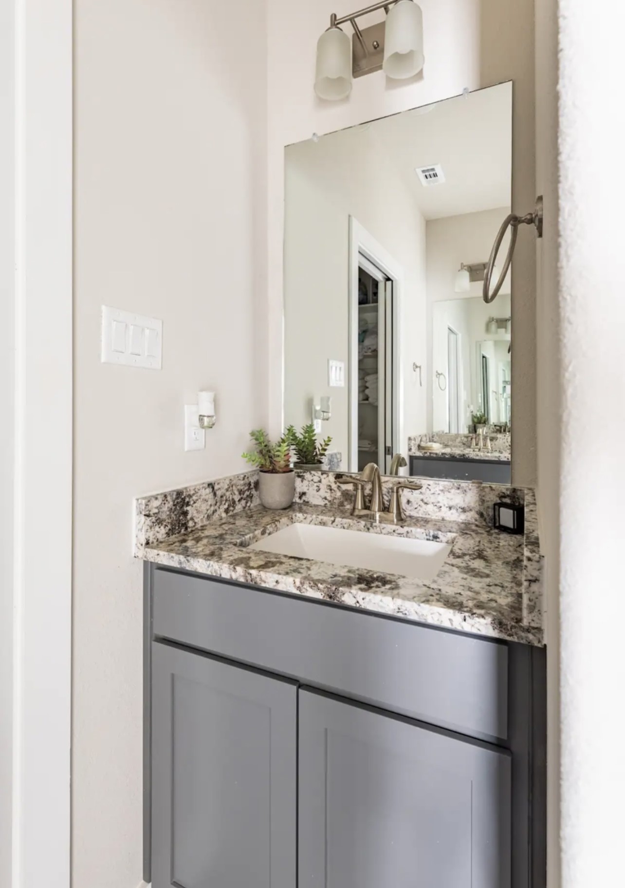 1740 Cove Crescent Houston, TX 77055 - Photo 36 of 44 a bathroom with a granite countertop sink and a mirror