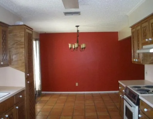 a view of a livingroom with a kitchen