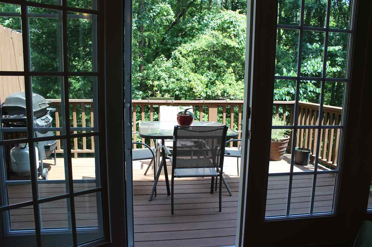 2822 Pickett Road, Unit 169 Durham, NC 27705 - Photo 4 of 17 Relax and unwind on the large, private deck surrounded by lush greenery. Patio/Deck