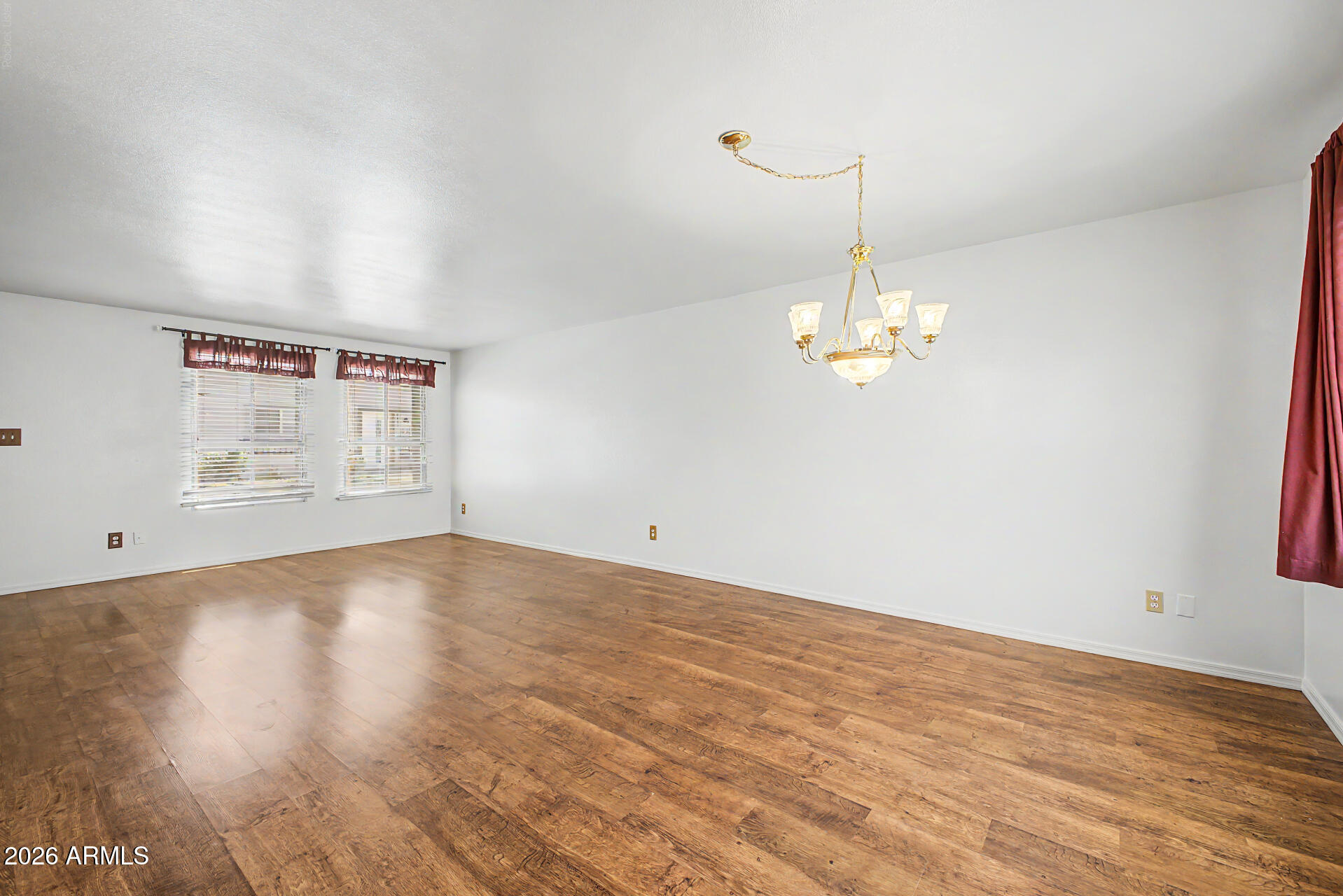 5873 East Thomas Road Scottsdale, AZ 85251 - Photo 3 of 30 a view of empty room with wooden floor