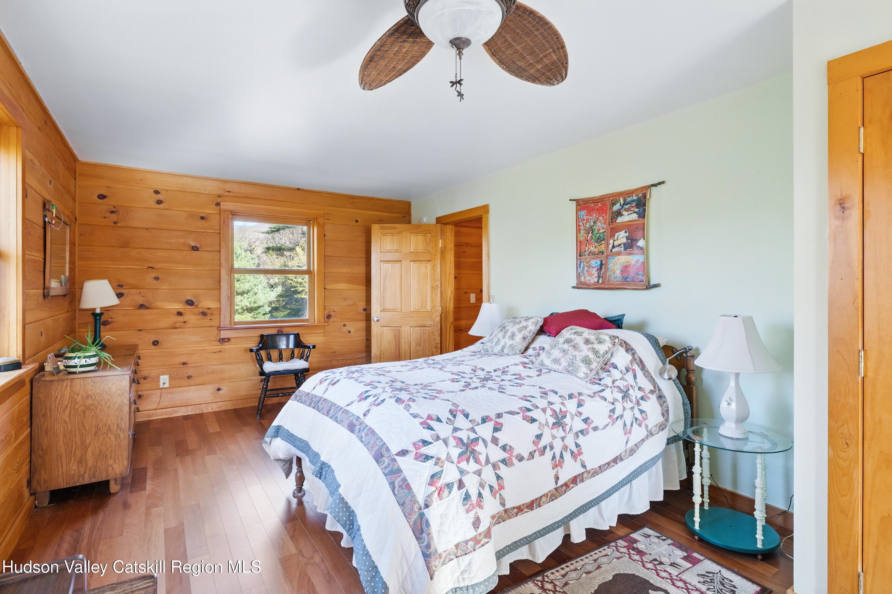 48 Hillside Drive West Shokan, NY 12494 - Photo 15 of 30 a bedroom with a bed and wooden floor