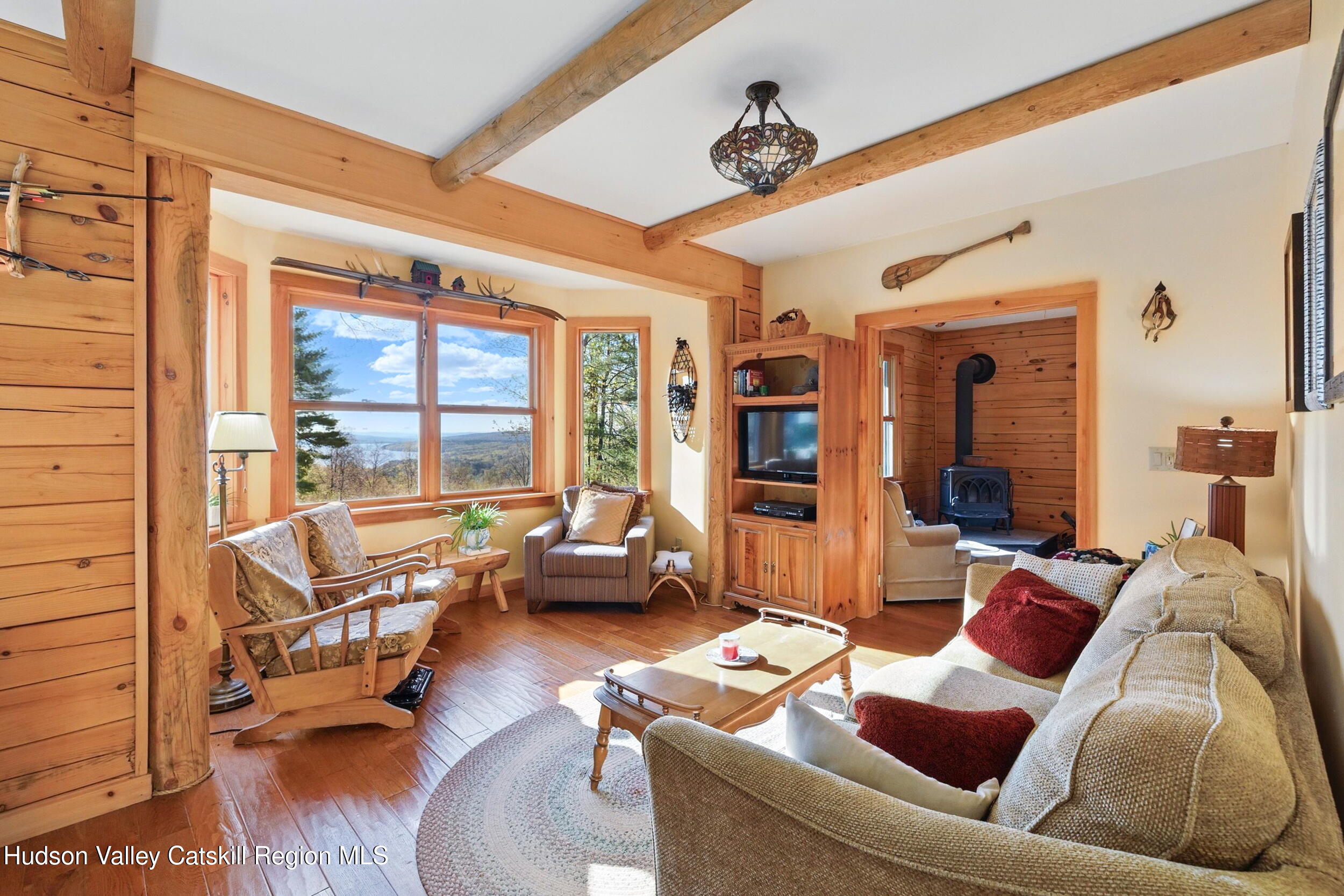 48 Hillside Drive West Shokan, NY 12494 - Photo 5 of 30 a living room with furniture and a floor to ceiling window
