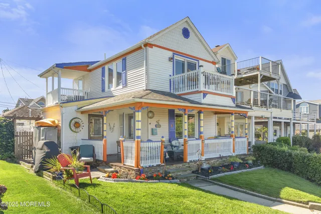 a front view of house with yard and outdoor seating