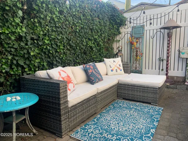 a outdoor living space with furniture and a view of a couch