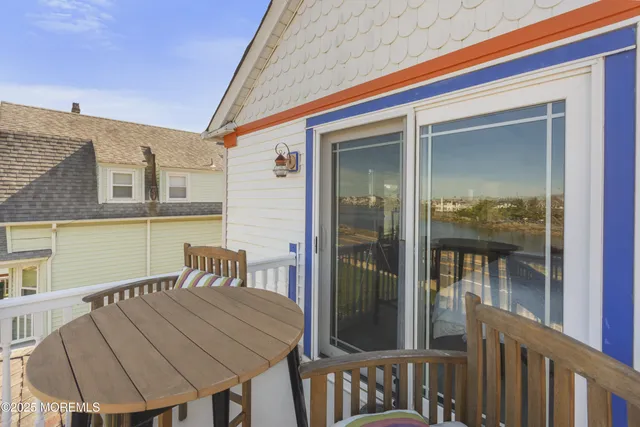 a view of a balcony and table and chairs