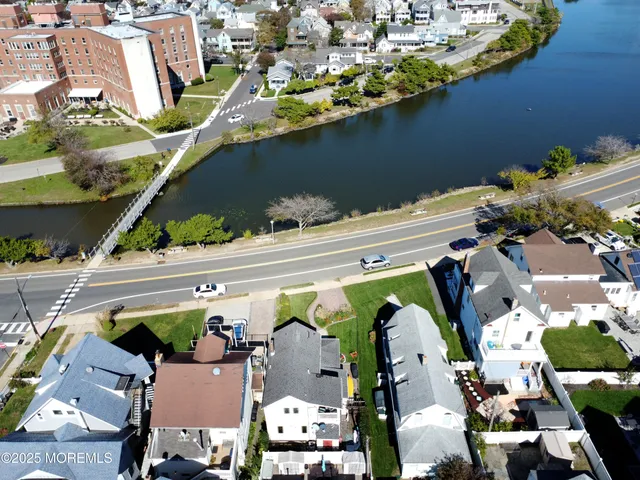 an aerial view of a house with a garden and swimming pool